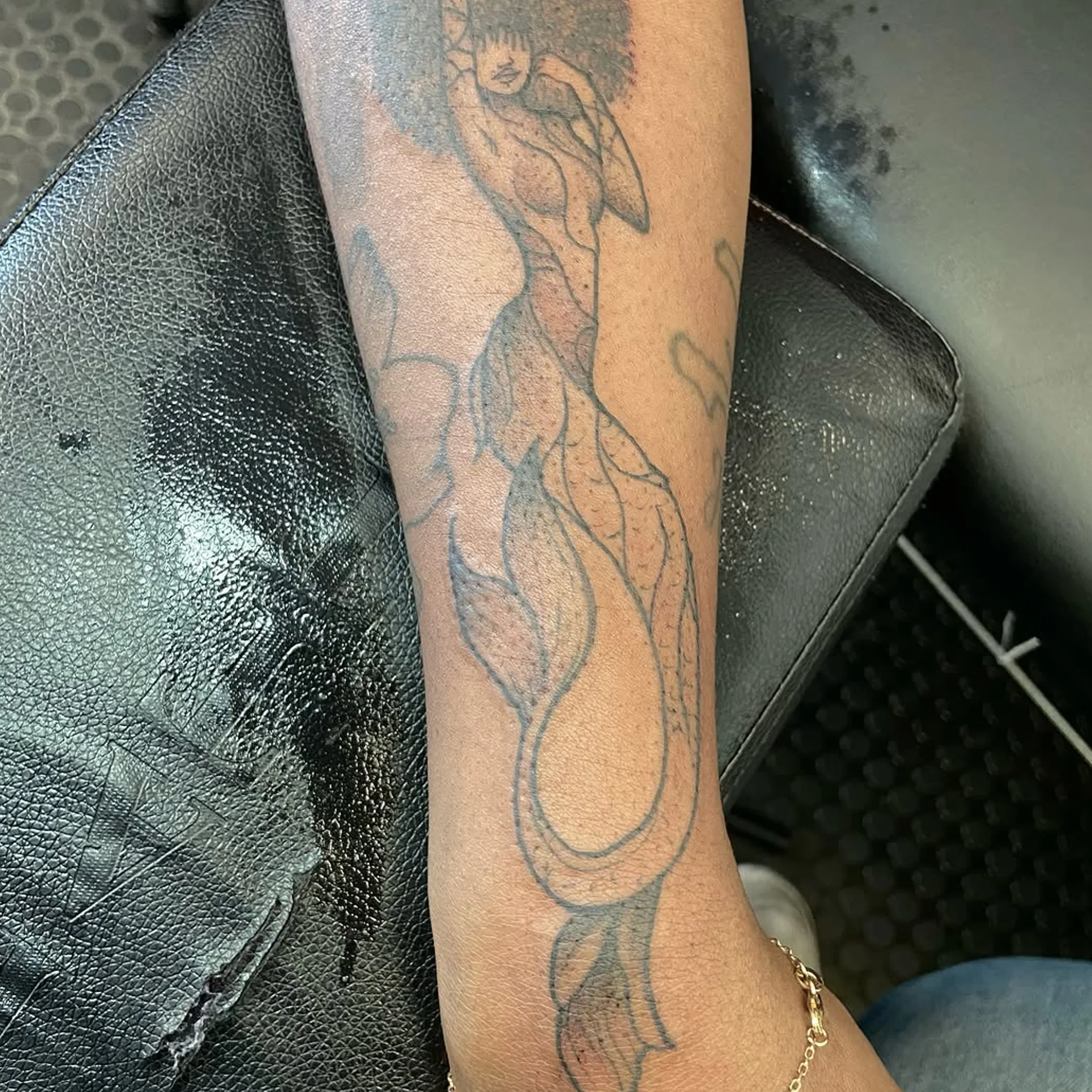 close-up of clear tattoo on skin